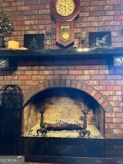 376 Paoli Road Carlton, GA 30627 - Photo 43 of 51 a fireplace with a clock on it