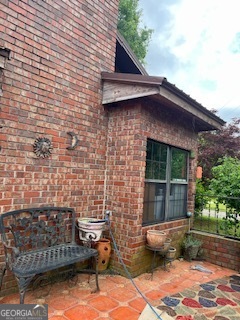 376 Paoli Road Carlton, GA 30627 - Photo 5 of 51 a view of a brick house with a yard