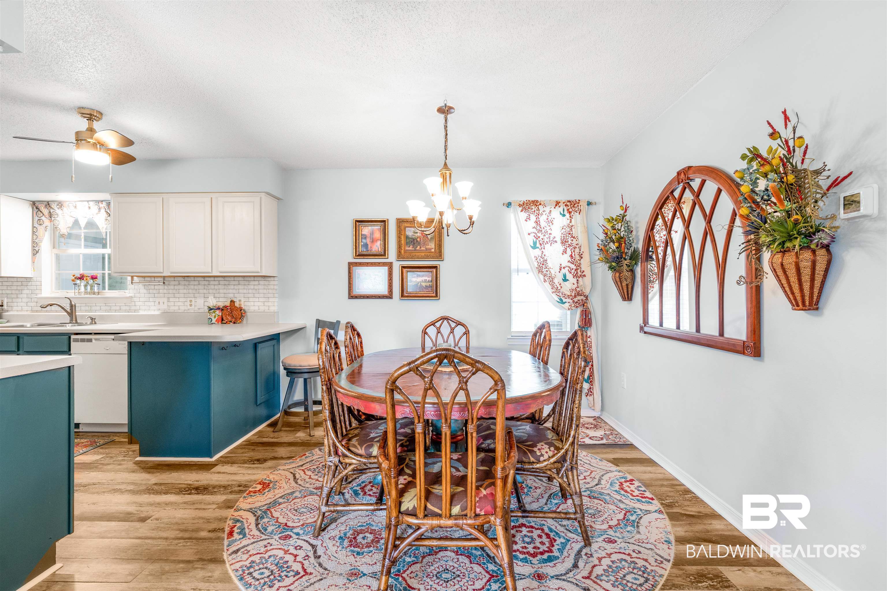 518 Ariel Avenue Foley, AL 36535 - Photo 9 of 47 Dining room featuring light wood-type flooring, ceiling fan with notable chandelier, plenty of natural light, and a textured ceiling