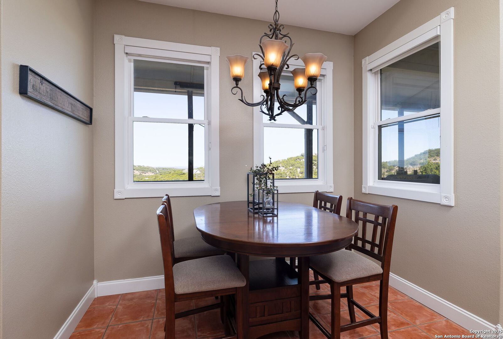 42 Tower Road Boerne, TX 78006 - Photo 13 of 50 a view of a dining room with furniture a chandelier and wooden floor