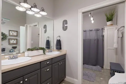 a white toilet sitting next to a bathroom sink