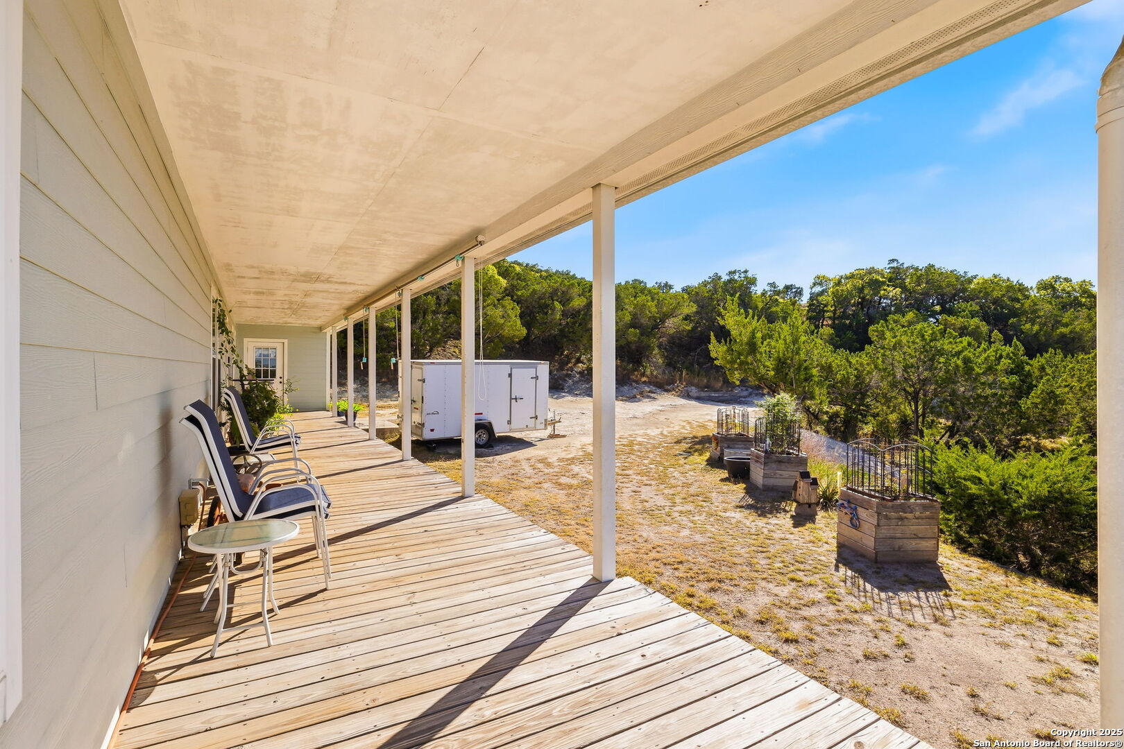 42 Tower Road Boerne, TX 78006 - Photo 29 of 50 a balcony with chairs and with wooden floor