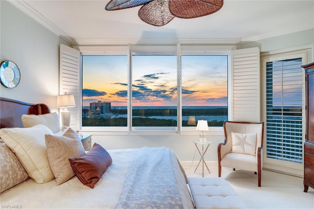 265 Indies Way, Unit 802 Naples, FL 34110 - Photo 22 of 50 a living room with furniture and a large window