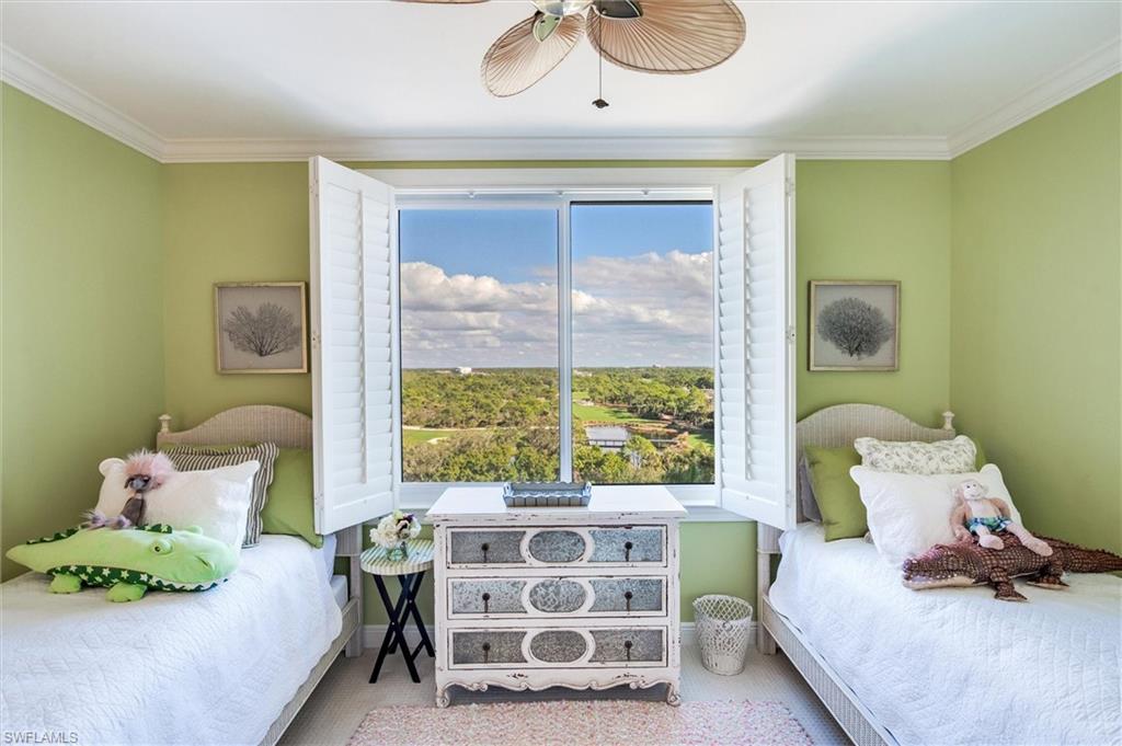 265 Indies Way, Unit 802 Naples, FL 34110 - Photo 36 of 50 a bedroom with a bed and a window