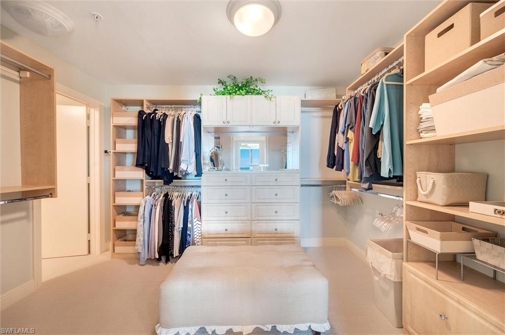 265 Indies Way, Unit 802 Naples, FL 34110 - Photo 38 of 50 a view of walk in closet with clothes and shoes