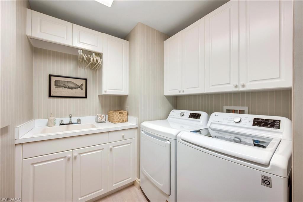265 Indies Way, Unit 802 Naples, FL 34110 - Photo 39 of 50 a utility room with dryer and washer