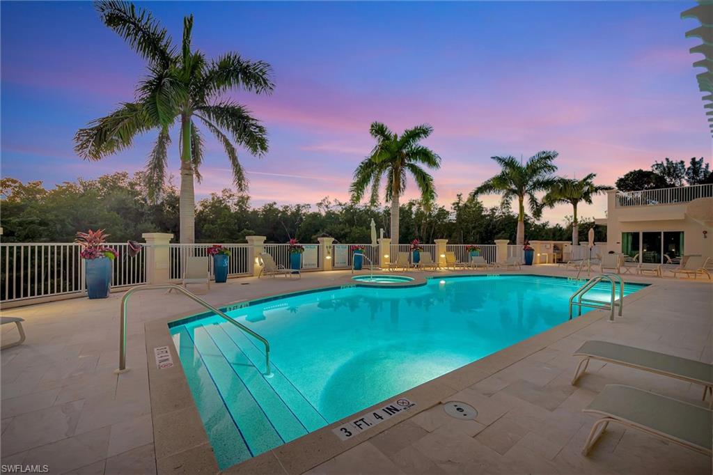 265 Indies Way, Unit 802 Naples, FL 34110 - Photo 41 of 50 a view of a swimming pool with a patio