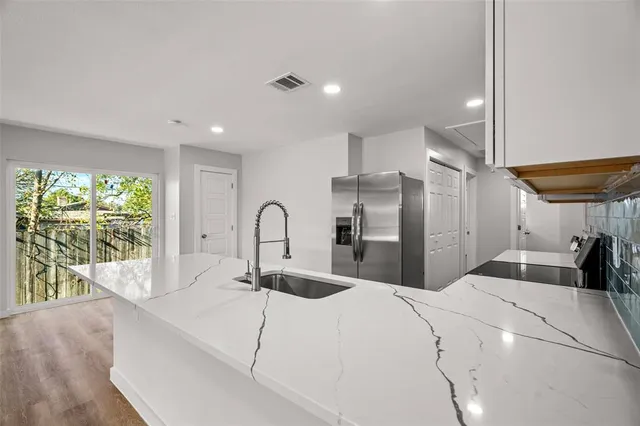 a bed room with a bed and a large window