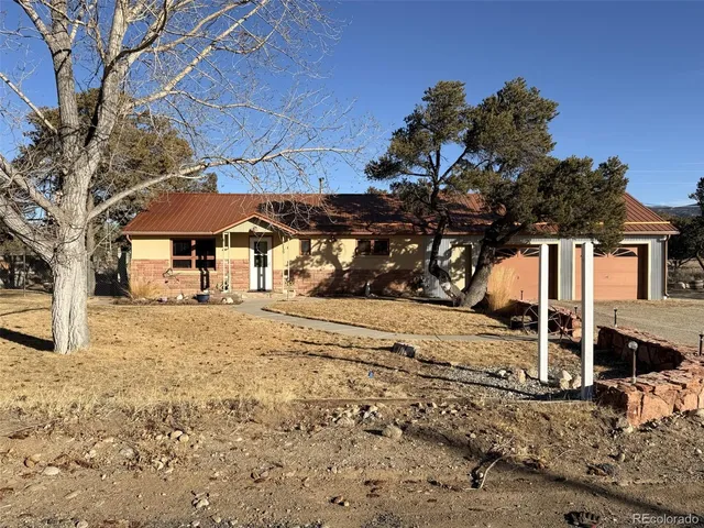 a view of a house with a snow in the yard