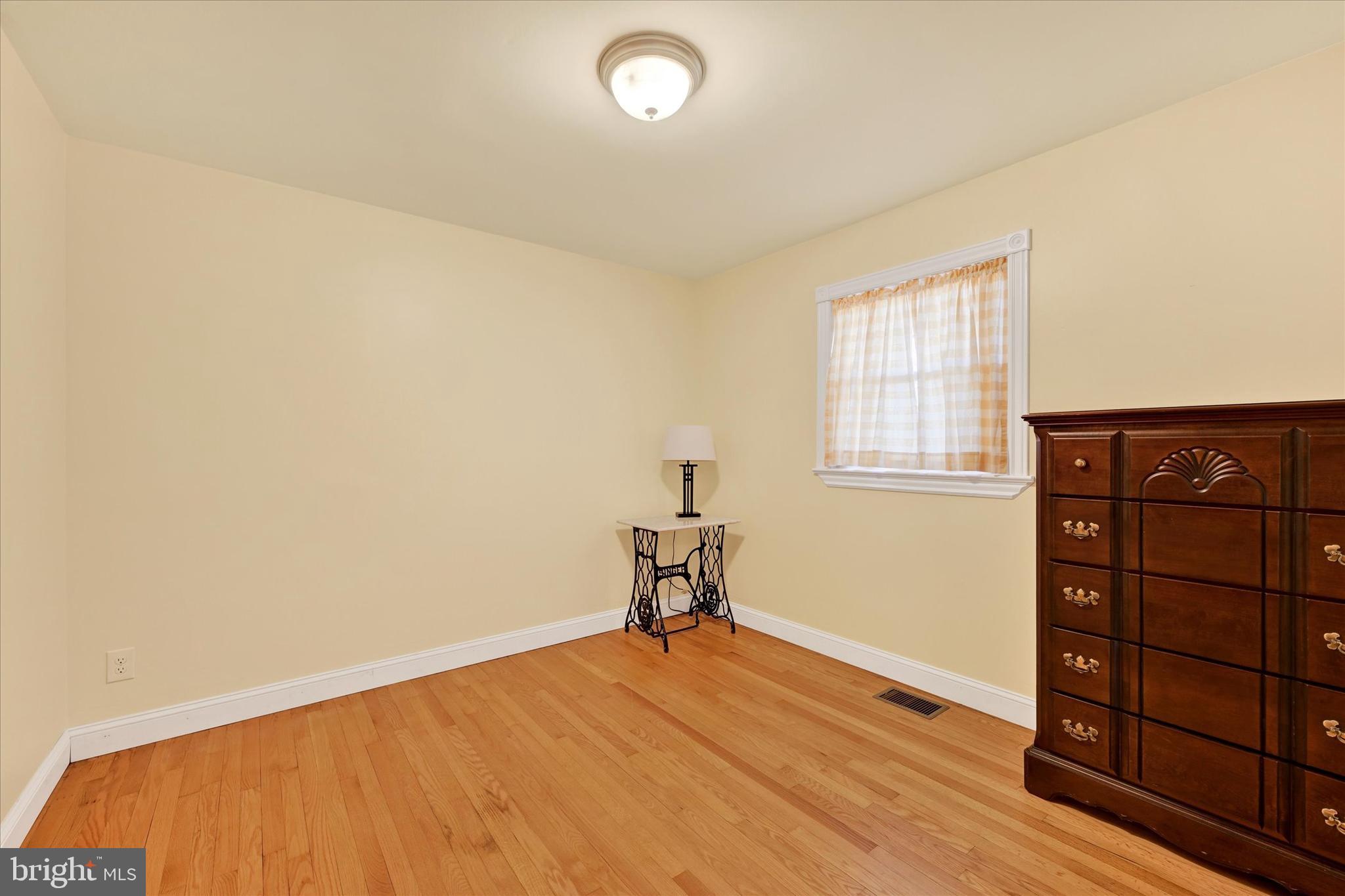 2524 Jennings Chapel Road Woodbine, MD 21797 - Photo 15 of 41 a view of a room with wooden floor and cabinet