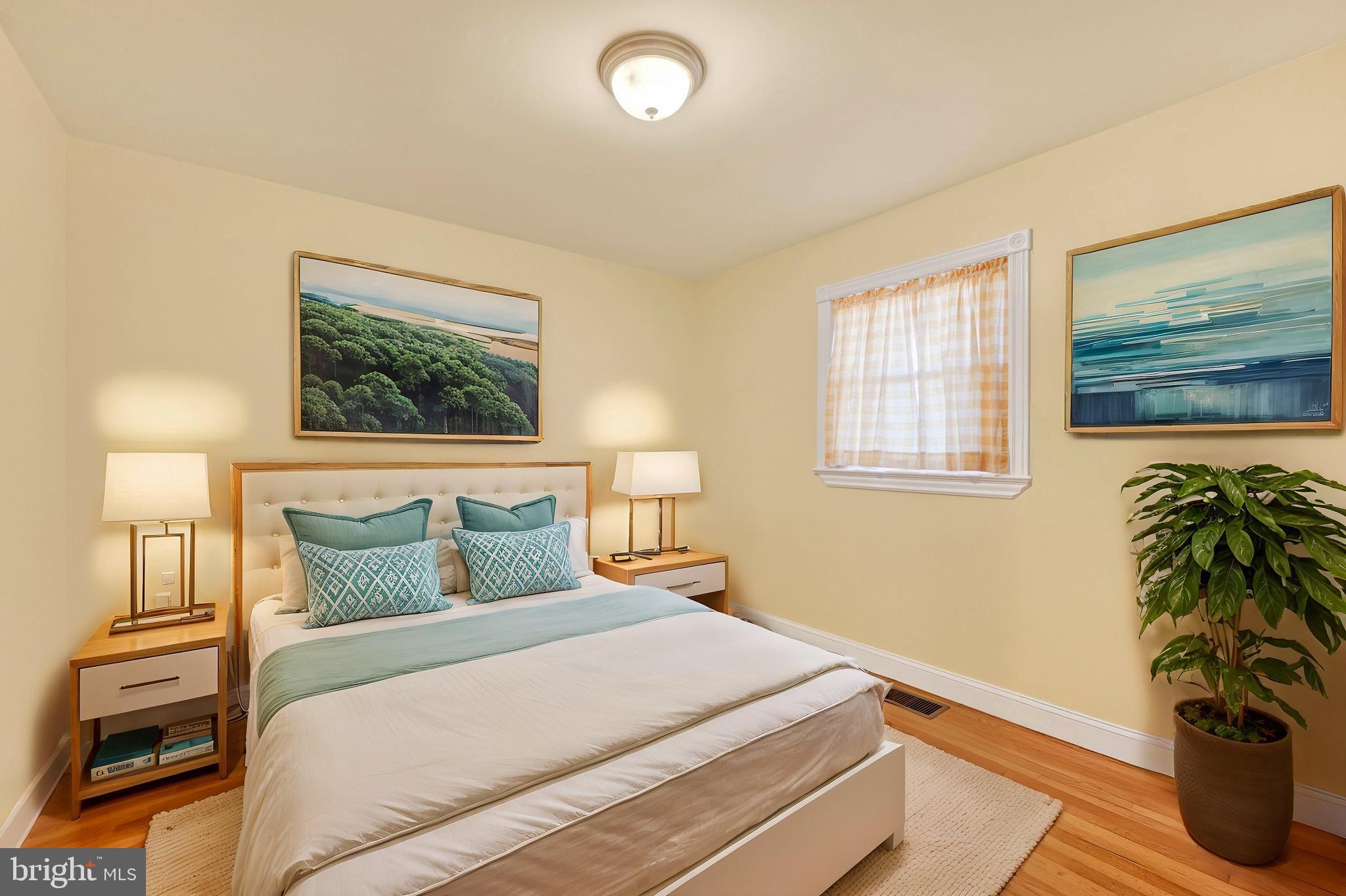 2524 Jennings Chapel Road Woodbine, MD 21797 - Photo 16 of 41 a bedroom with a bed and a potted plant