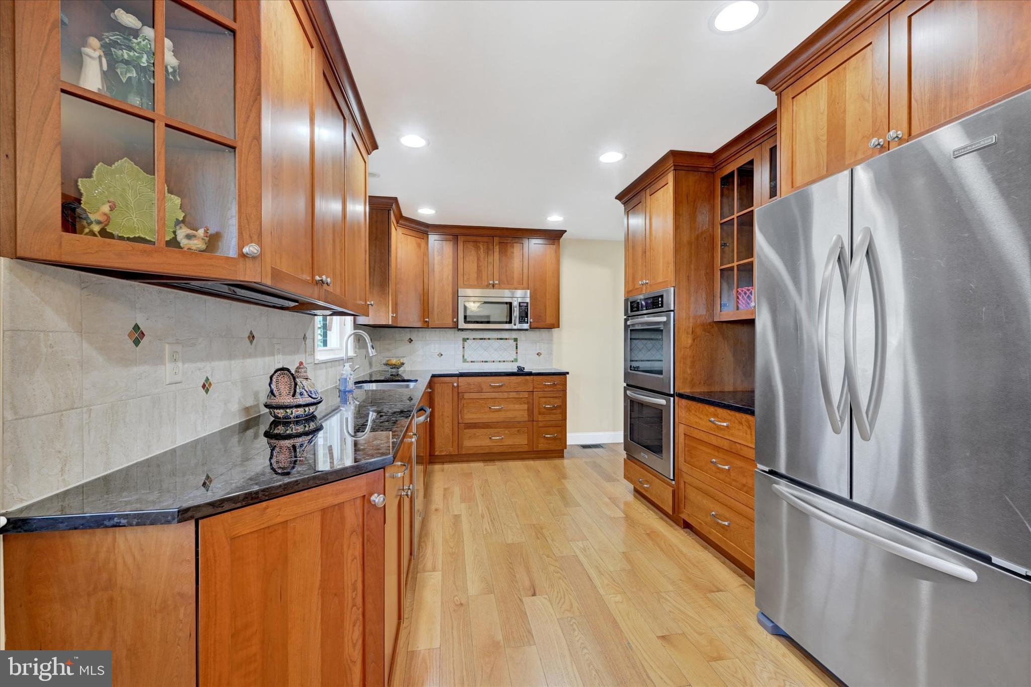 2524 Jennings Chapel Road Woodbine, MD 21797 - Photo 2 of 41 a kitchen with stainless steel appliances granite countertop a refrigerator a sink and a stove