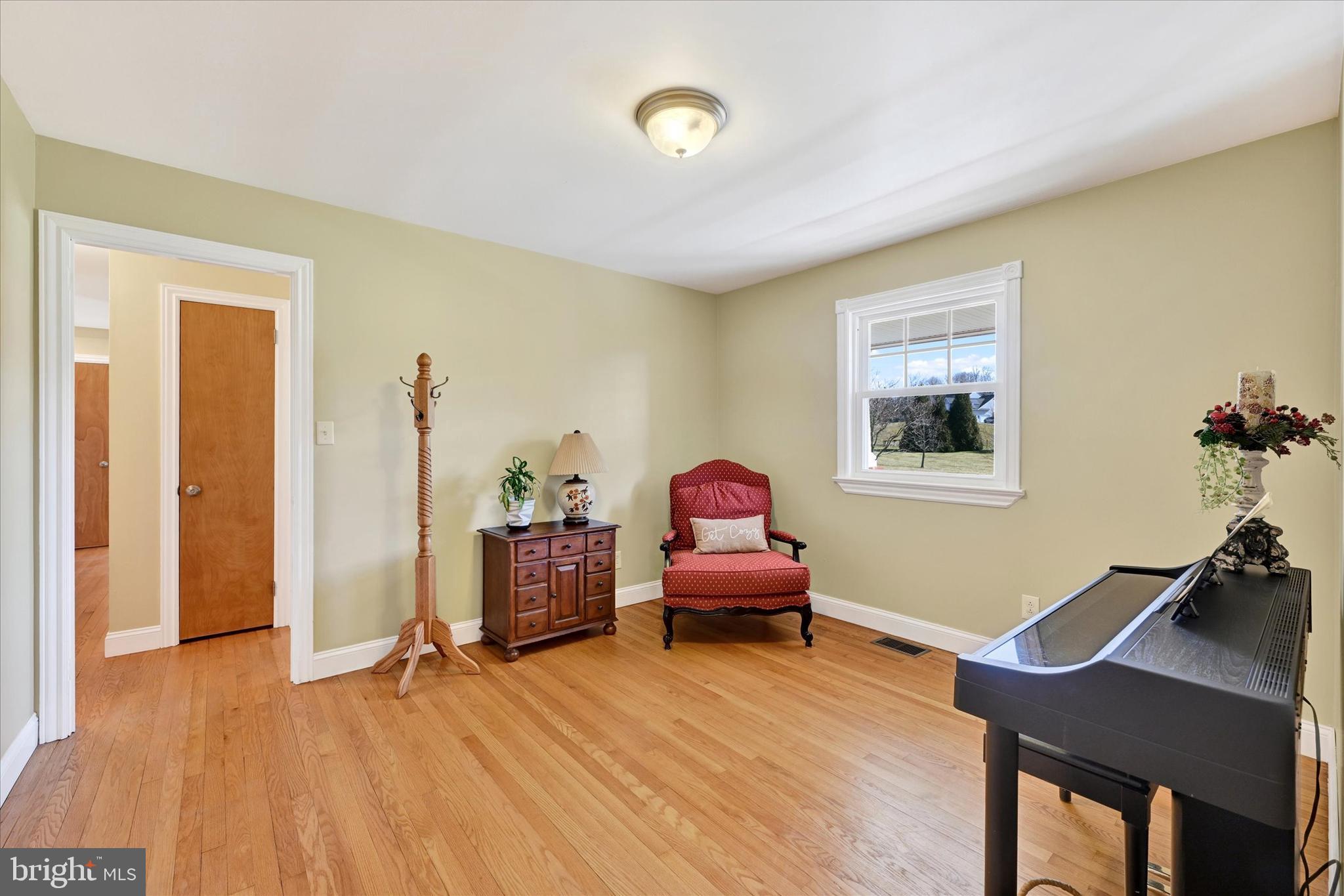 2524 Jennings Chapel Road Woodbine, MD 21797 - Photo 21 of 41 a living room with furniture and a wooden floor