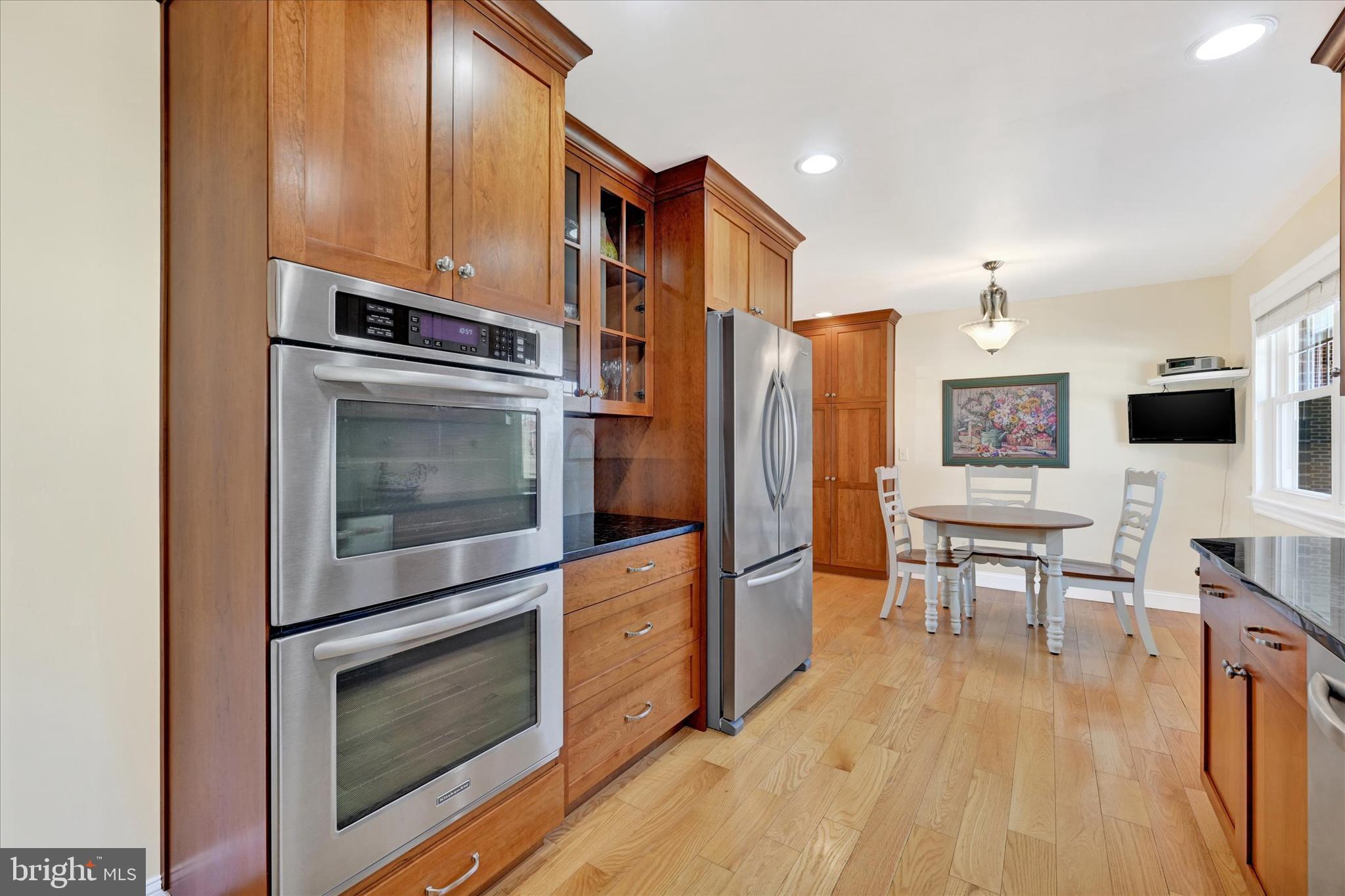 2524 Jennings Chapel Road Woodbine, MD 21797 - Photo 4 of 41 a kitchen with stainless steel appliances a stove a microwave and cabinets
