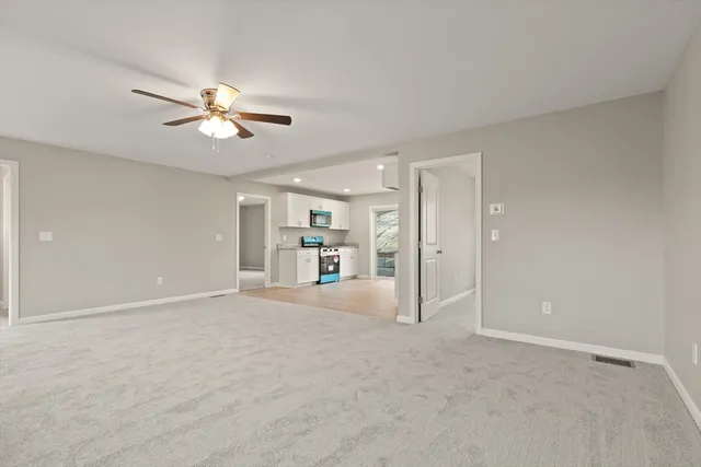 a view of empty room with fan