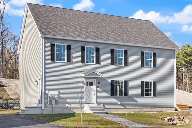 a front view of a house with swimming pool