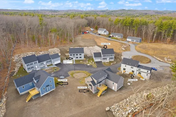 a aerial view of residential houses with outdoor space
