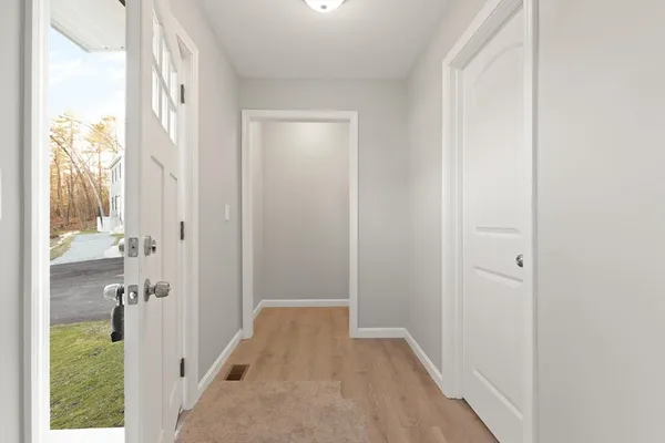 a view of a bathroom from a corridor