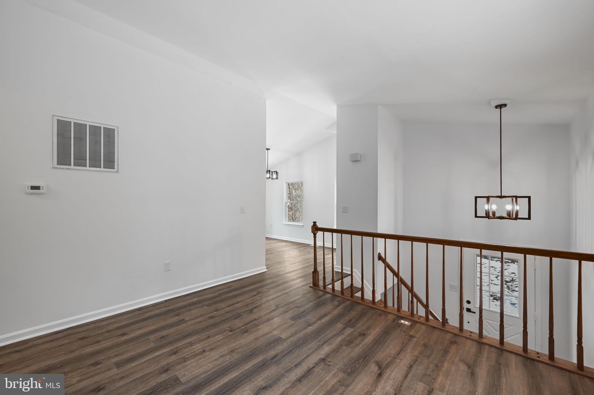 1024 Gringo Lane Lusby, MD 20657 - Photo 11 of 25 a view of a hallway with wooden floor