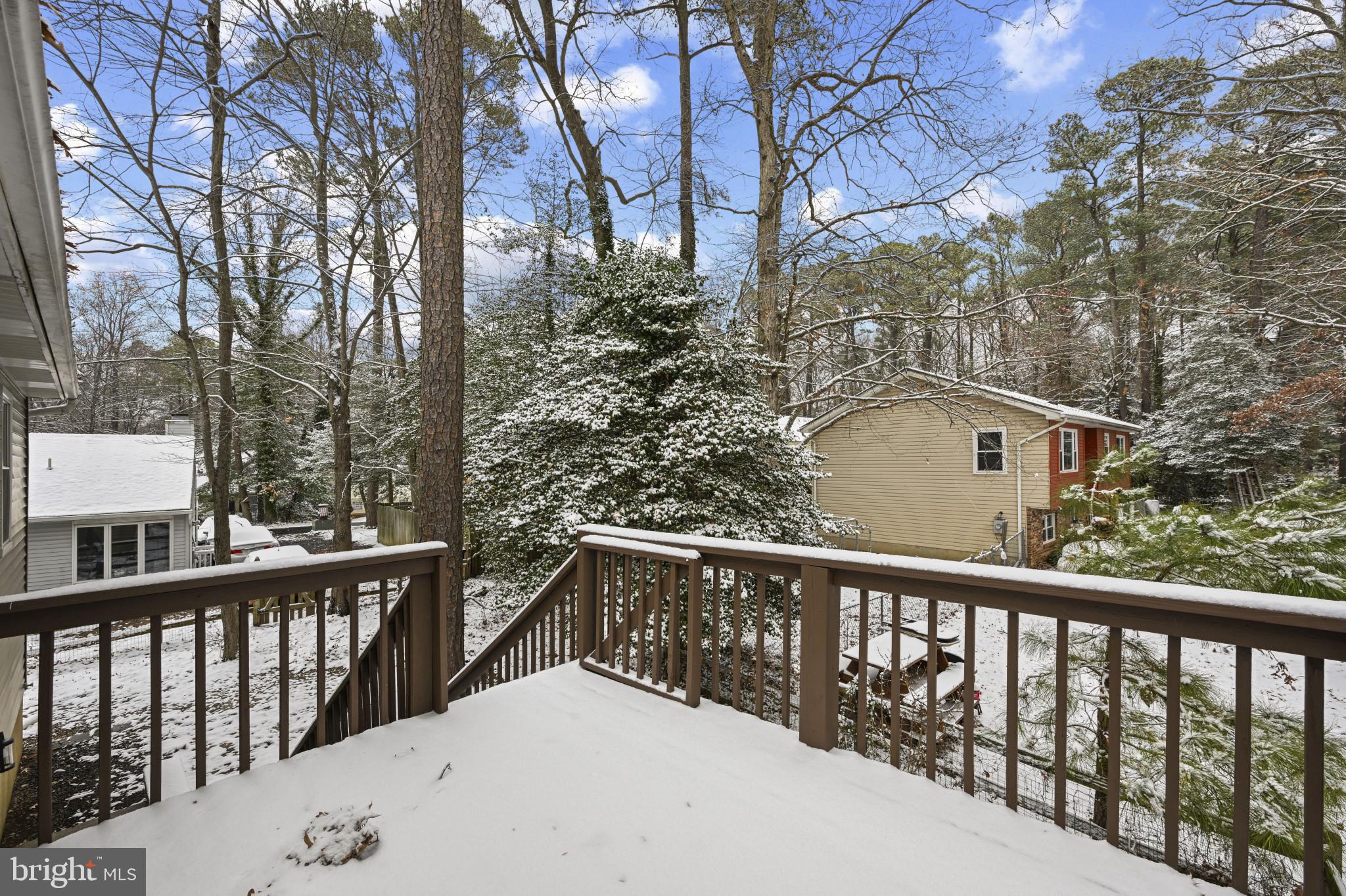 1024 Gringo Lane Lusby, MD 20657 - Photo 21 of 25 a view of a balcony with wooden fence and floor