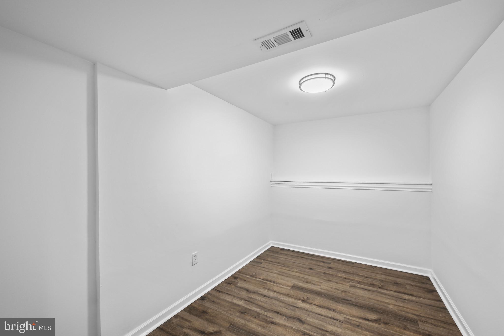 1024 Gringo Lane Lusby, MD 20657 - Photo 5 of 25 a view of a room with wooden floor