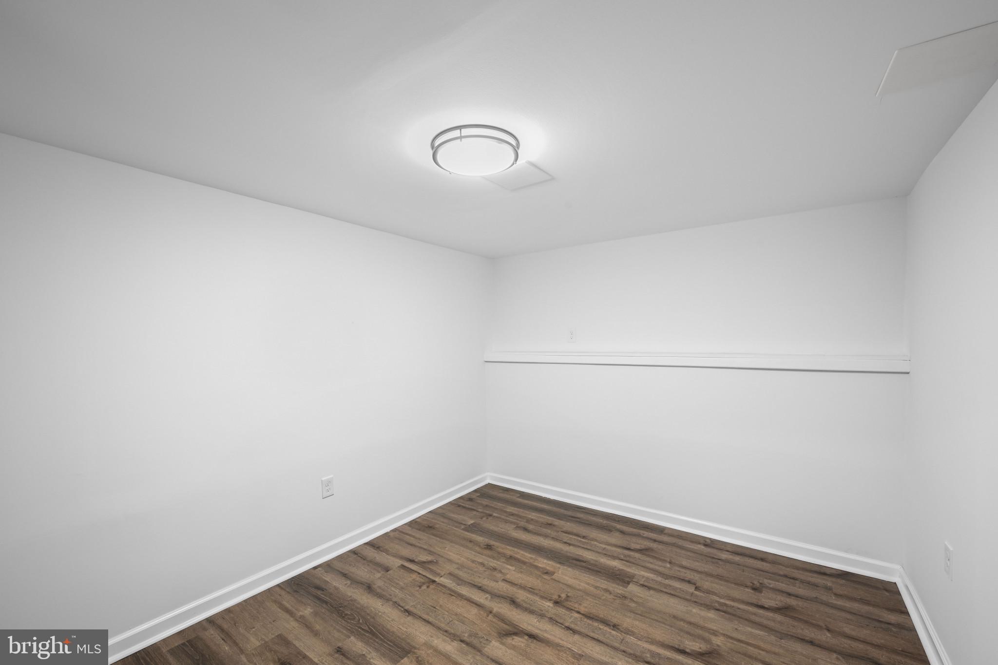 1024 Gringo Lane Lusby, MD 20657 - Photo 6 of 25 a view of a room with wooden floor