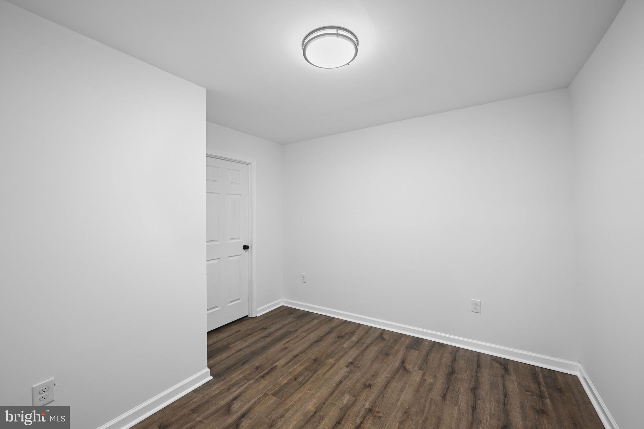 1024 Gringo Lane Lusby, MD 20657 - Photo 9 of 25 a view of a room with wooden floor and window
