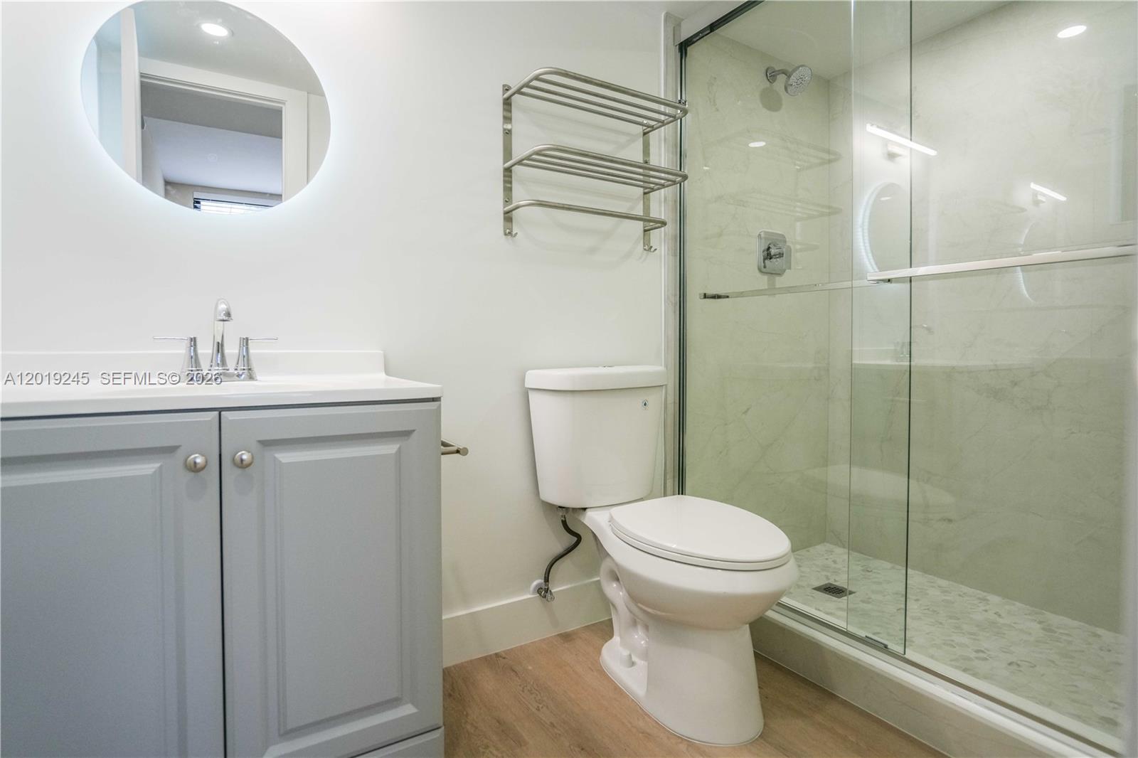 6960 Rue Vendome, Unit 201 Miami Beach, FL 33141 - Photo 17 of 27 a bathroom with a toilet and a sink