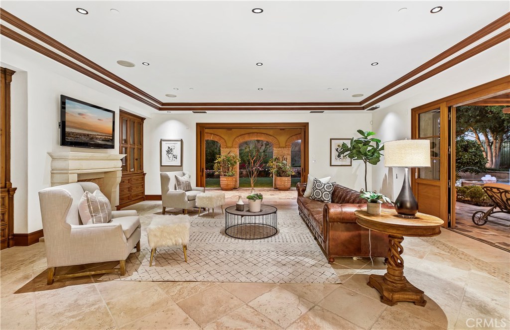 97 Canyon Creek Irvine, CA 92603 - Photo 11 of 28 a living room with fireplace furniture and a flat screen tv