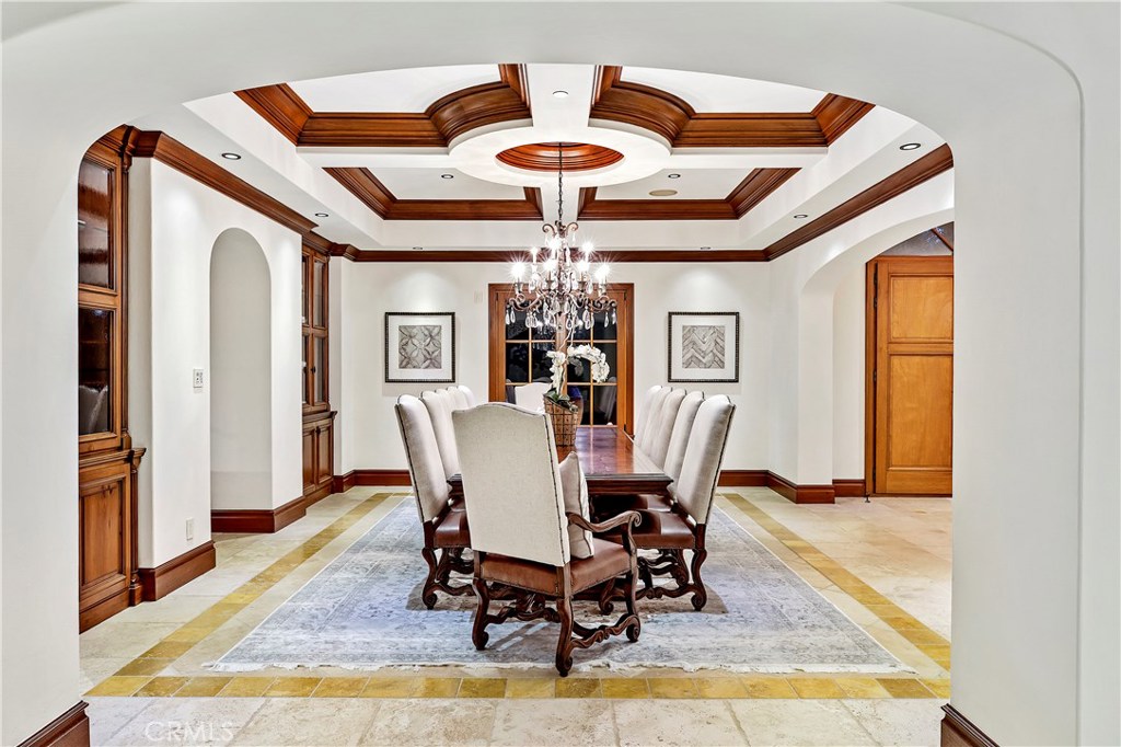 97 Canyon Creek Irvine, CA 92603 - Photo 17 of 28 a dining room with furniture a chandelier and wooden floor