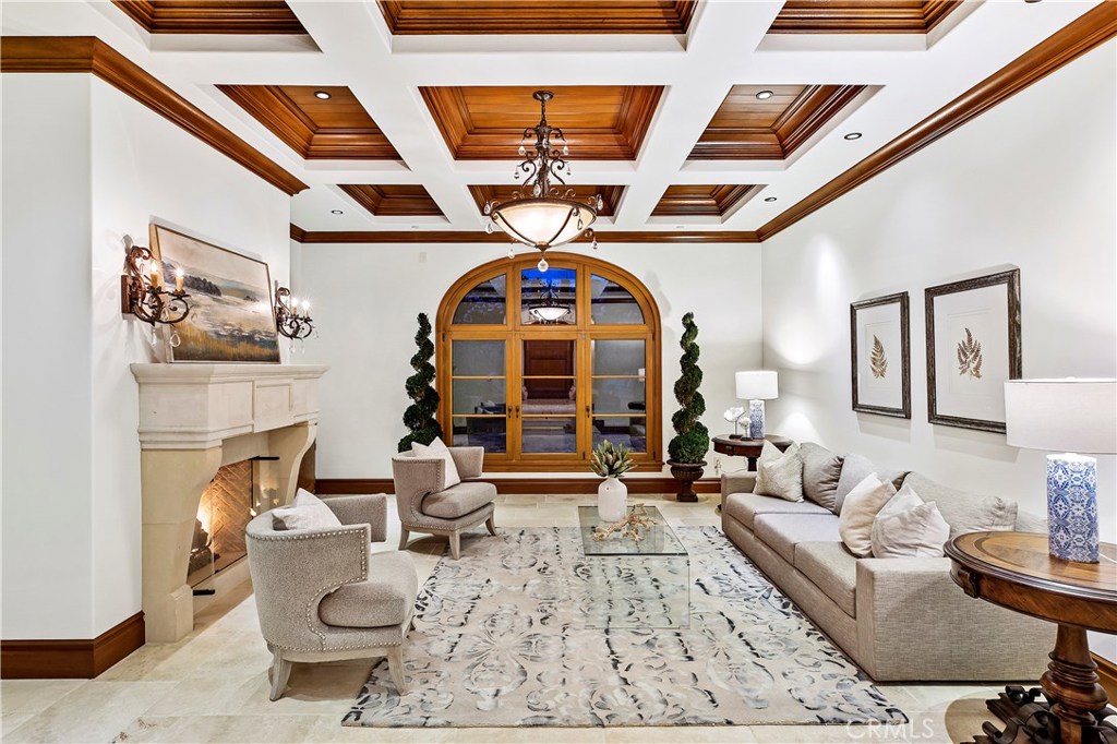 97 Canyon Creek Irvine, CA 92603 - Photo 18 of 28 a living room with furniture and a chandelier
