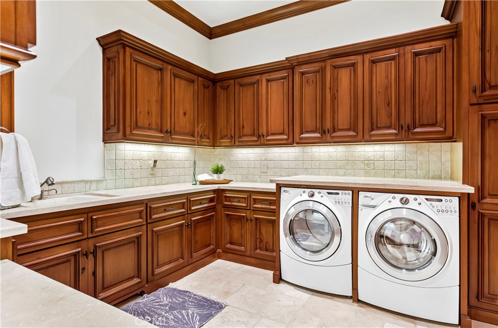 97 Canyon Creek Irvine, CA 92603 - Photo 19 of 28 a utility room with sink dryer and washer