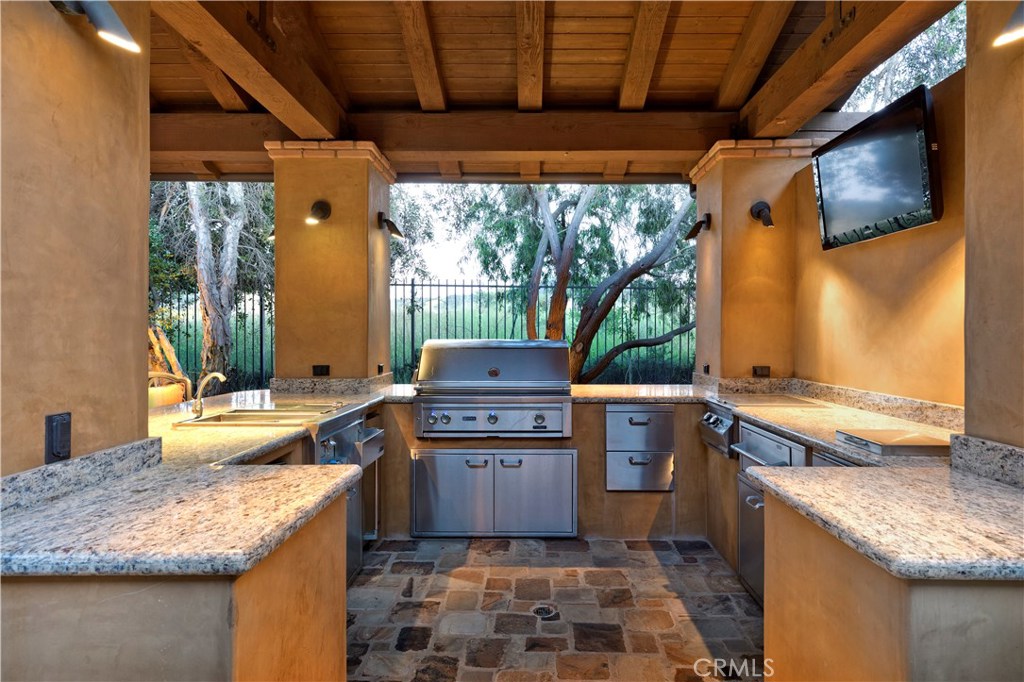 97 Canyon Creek Irvine, CA 92603 - Photo 25 of 28 a kitchen with a stove and a sink