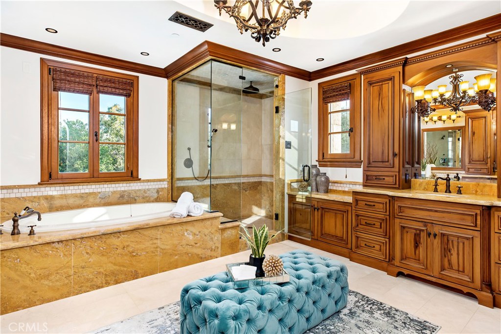 97 Canyon Creek Irvine, CA 92603 - Photo 8 of 28 a bathroom with a tub sink and mirror