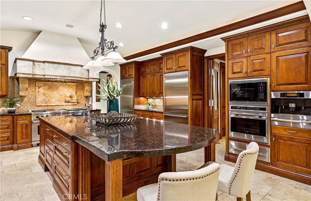 97 Canyon Creek Irvine, CA 92603 - Photo 10 of 28 a kitchen with stainless steel appliances granite countertop a stove a sink and a refrigerator