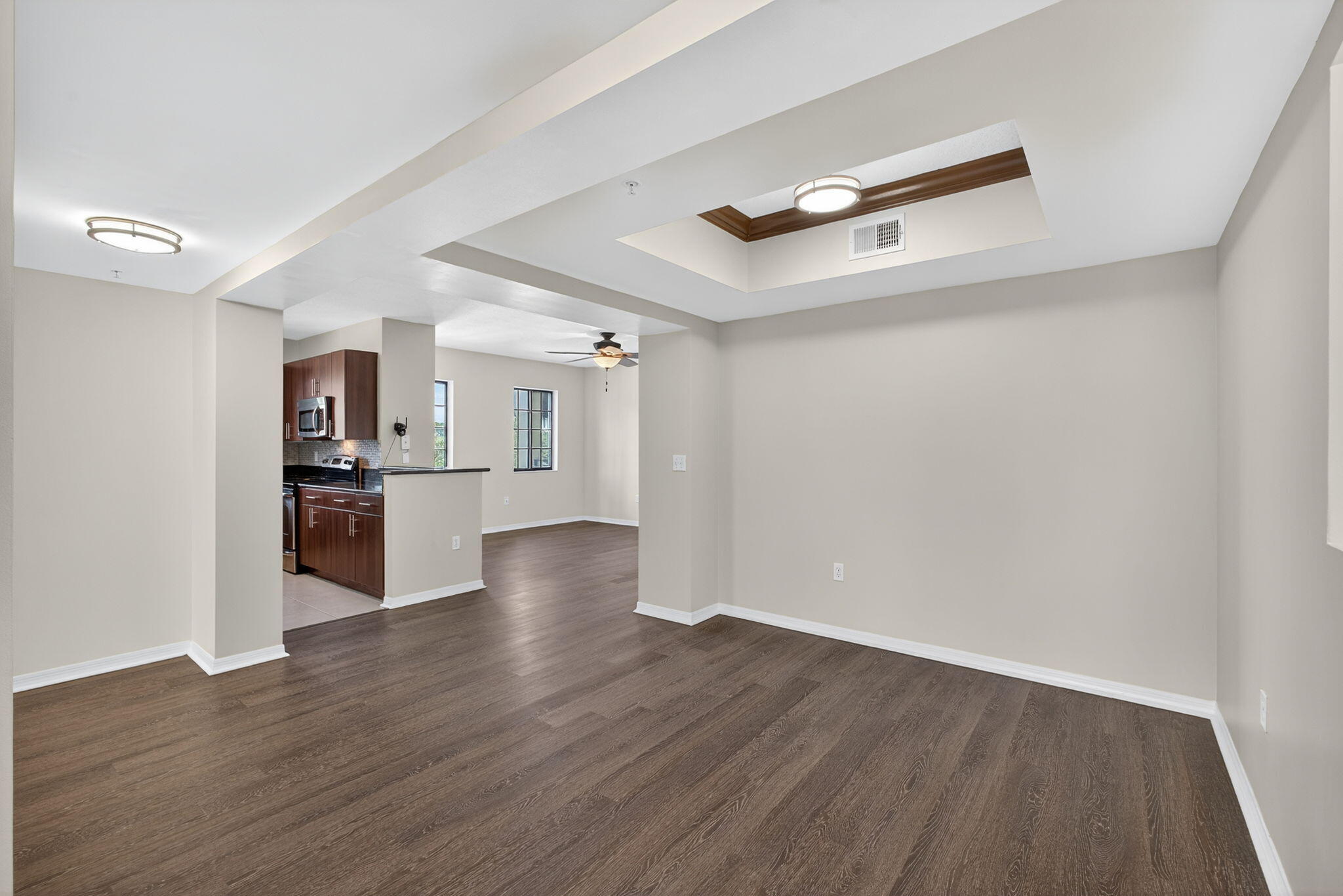 4907 Midtown Lane, Unit 1314 Palm Beach Gardens, FL 33418 - Photo 11 of 57 a view of a kitchen with wooden floor and a sink