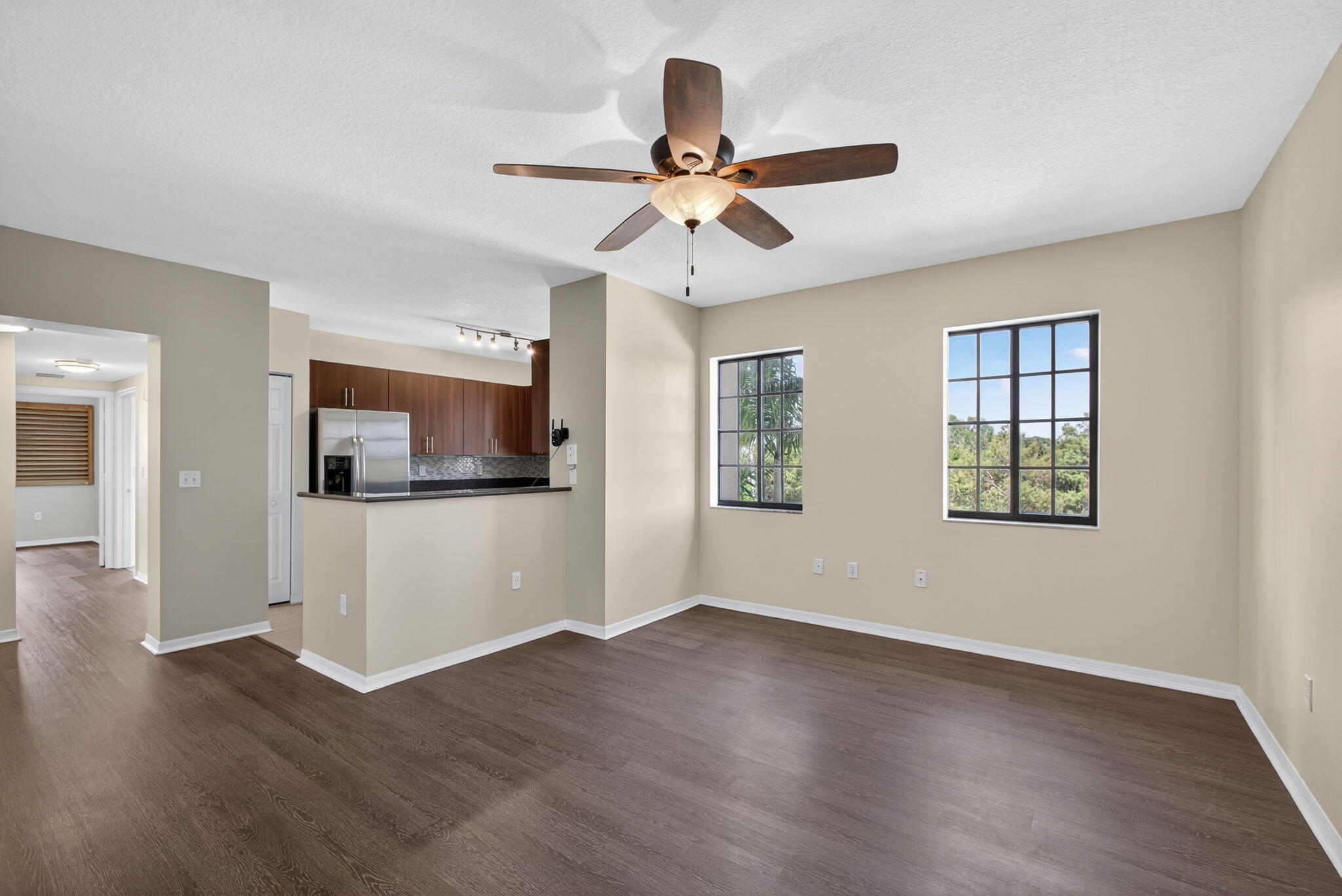 4907 Midtown Lane, Unit 1314 Palm Beach Gardens, FL 33418 - Photo 14 of 57 a view of empty room with wooden floor and ceiling fan