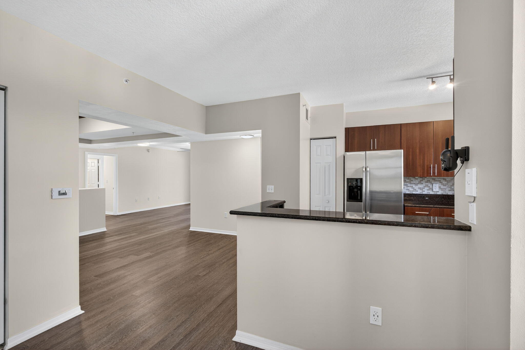 4907 Midtown Lane, Unit 1314 Palm Beach Gardens, FL 33418 - Photo 15 of 57 a view of a kitchen with a sink and a refrigerator