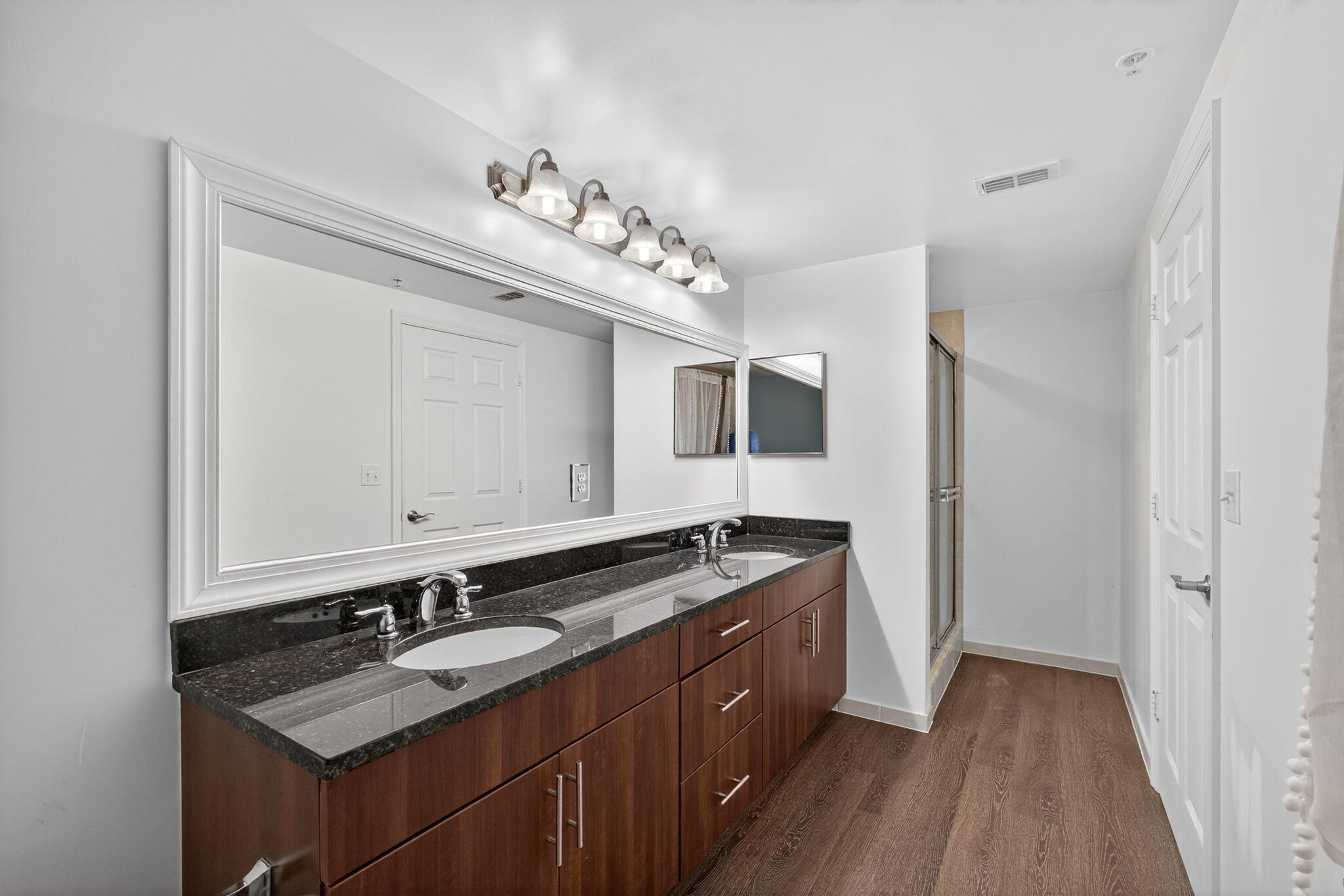 4907 Midtown Lane, Unit 1314 Palm Beach Gardens, FL 33418 - Photo 21 of 57 a bathroom with a granite countertop double vanity sink and mirror