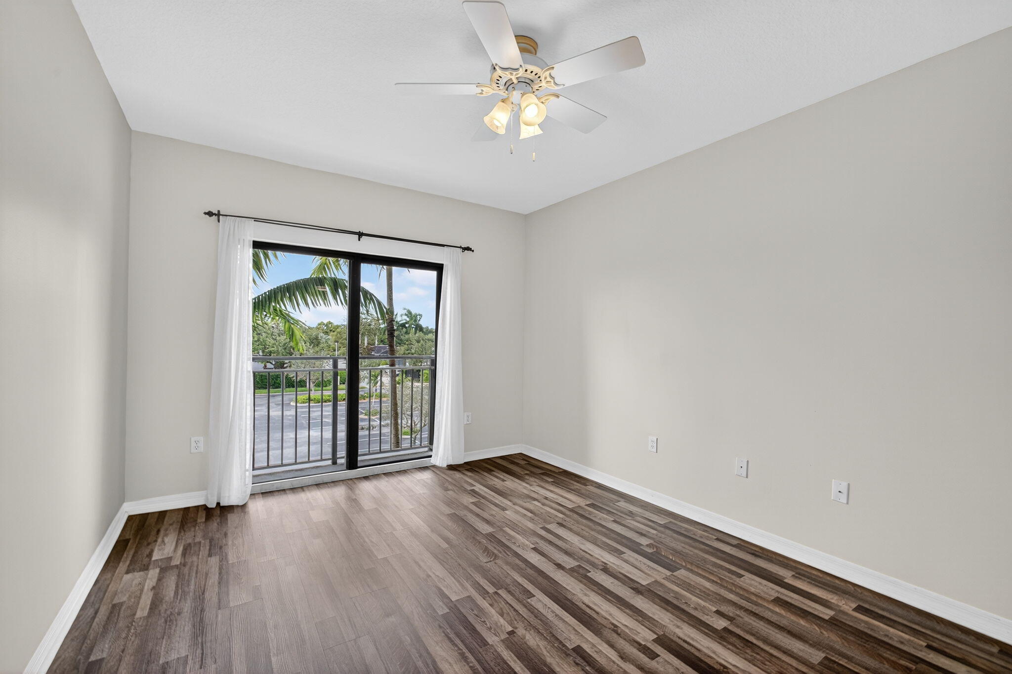 4907 Midtown Lane, Unit 1314 Palm Beach Gardens, FL 33418 - Photo 25 of 57 wooden floor in an empty room with a window