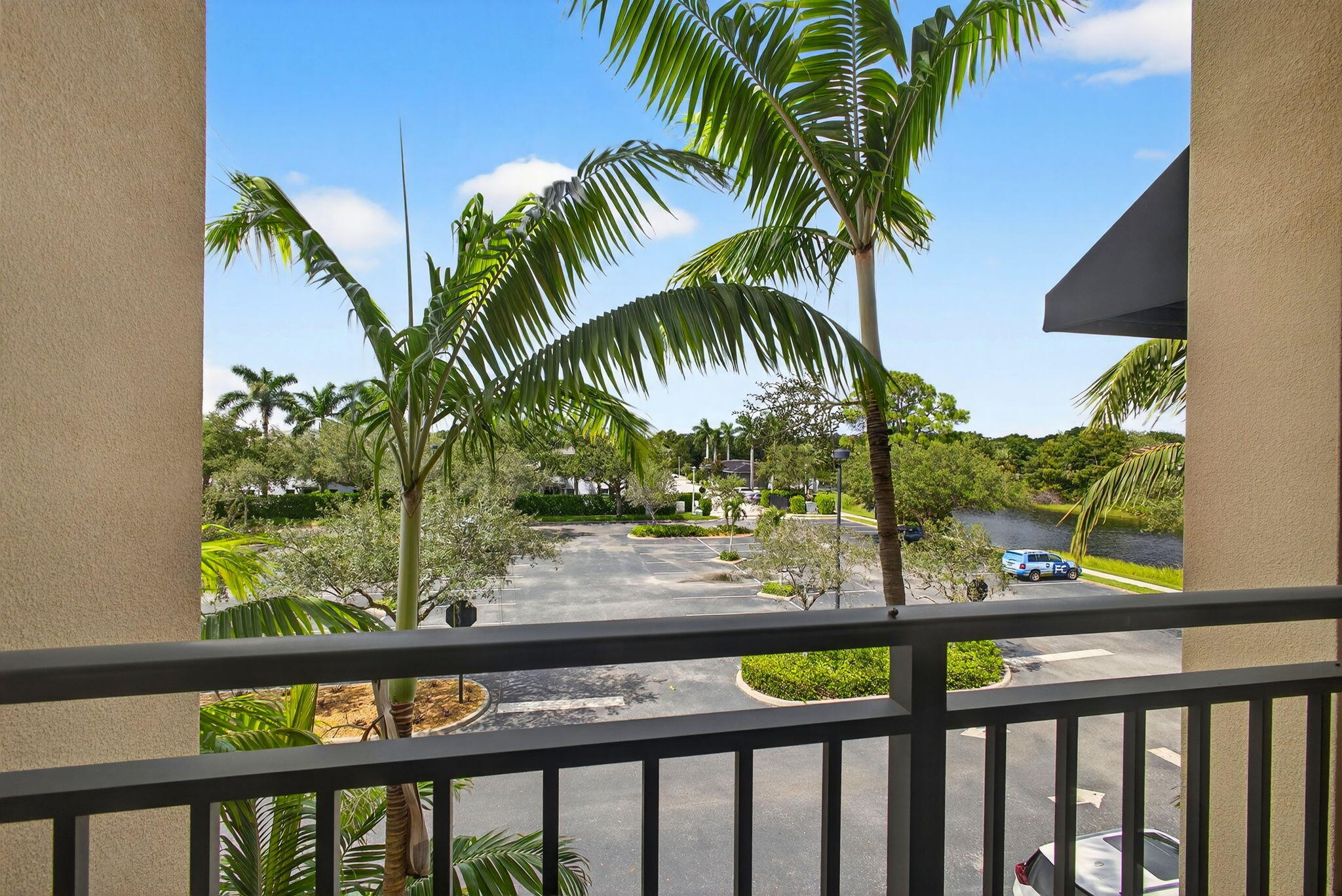 4907 Midtown Lane, Unit 1314 Palm Beach Gardens, FL 33418 - Photo 27 of 57 a view of a couple of palm trees