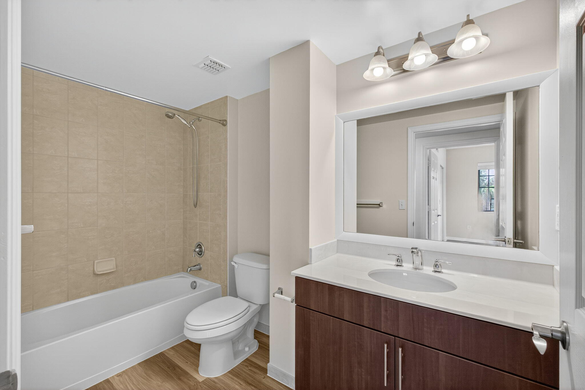 4907 Midtown Lane, Unit 1314 Palm Beach Gardens, FL 33418 - Photo 32 of 57 a bathroom with a sink a toilet and a bathtub