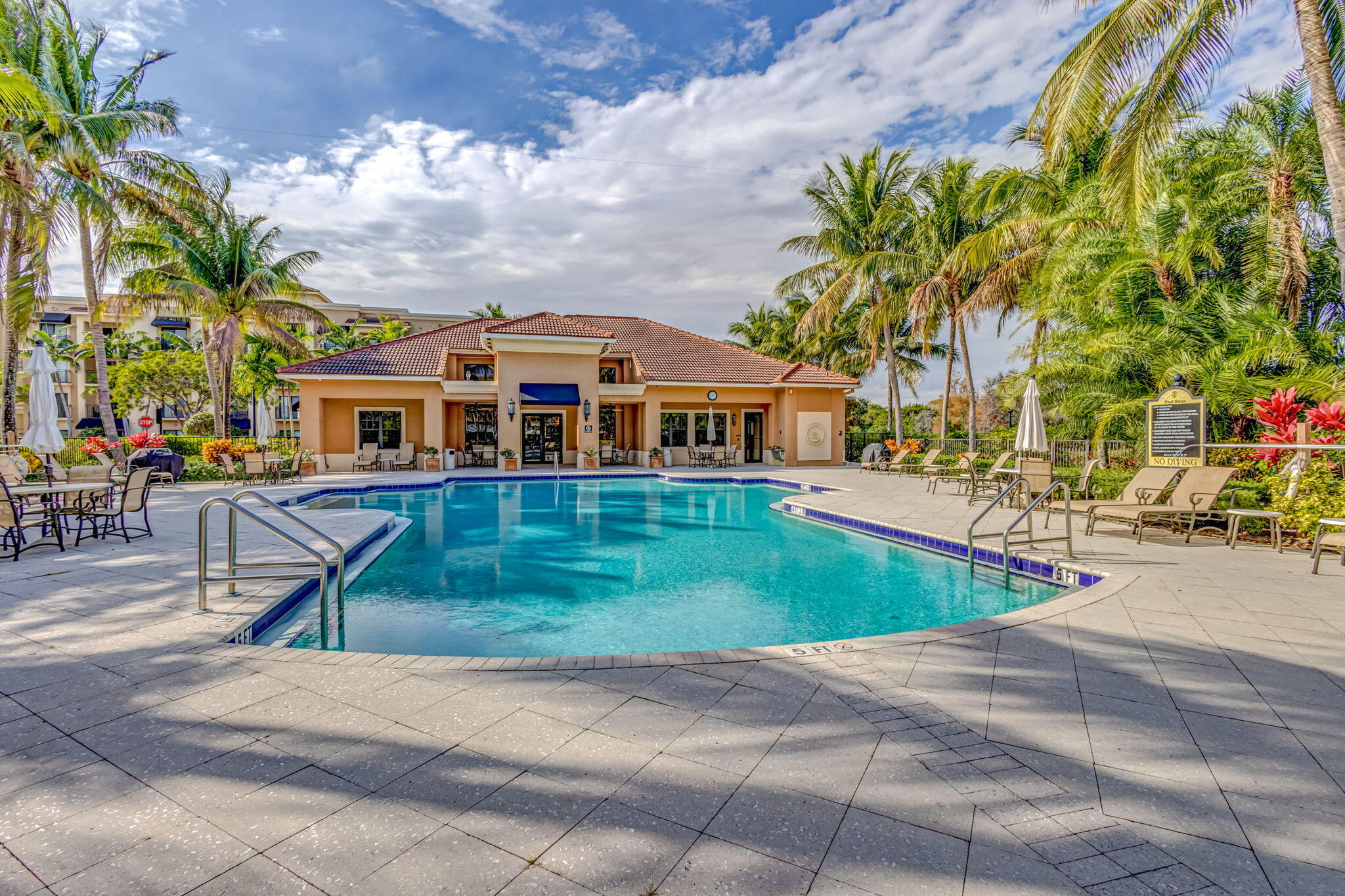 4907 Midtown Lane, Unit 1314 Palm Beach Gardens, FL 33418 - Photo 55 of 57 a view of a house with a swimming pool