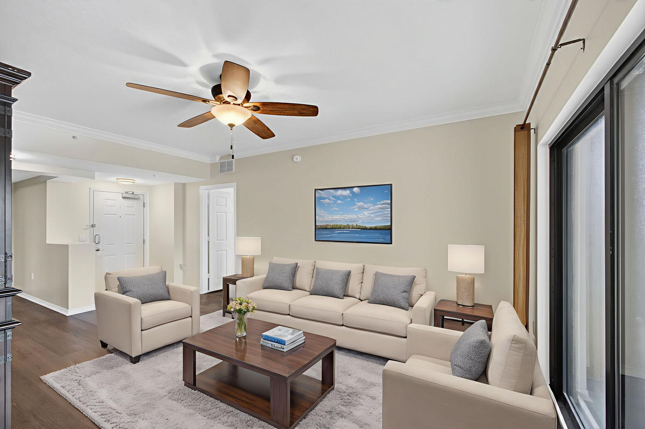 4907 Midtown Lane, Unit 1314 Palm Beach Gardens, FL 33418 - Photo 6 of 57 a living room with furniture and a ceiling fan