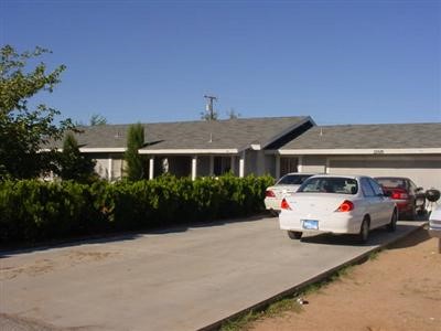 12616 Running Deer Road Apple Valley, CA 92308 - Photo 1 of 1 a car parked in front of a house