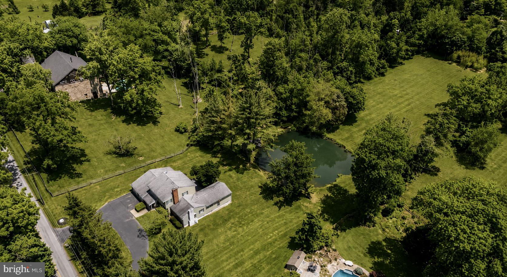 108 Sheeder Road Phoenixville, PA 19460 - Photo 40 of 42 an aerial view of residential house with outdoor space and trees all around