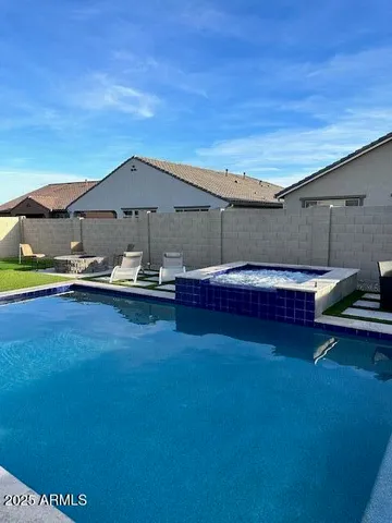 a view of outdoor space with swimming pool and furniture