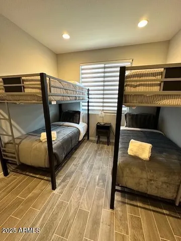 a bedroom with a bed and window