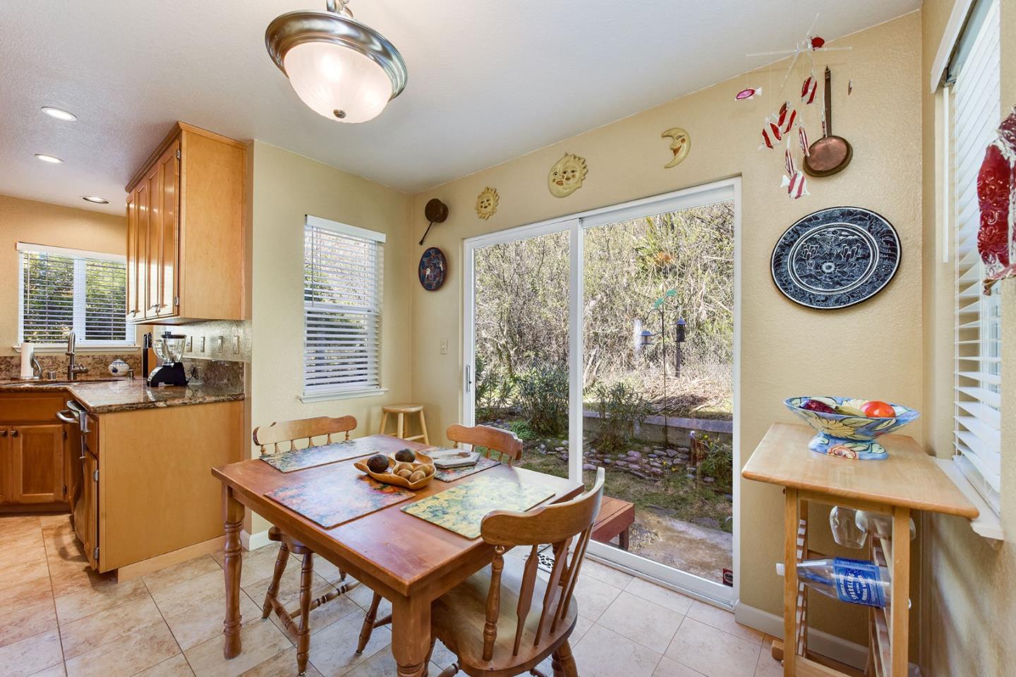 551 Monterey Road Pacifica, CA 94044 - Photo 18 of 36 a view of a dining room with a table and chairs