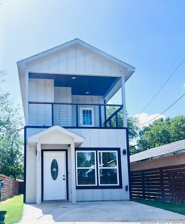 a front view of a house with a garage